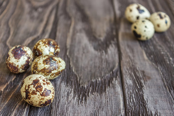 Quail eggs on a wooden table, a symbol of the Easter season. Healthy eating.