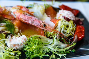 Assorted seafood: crab, prawns, langoustines are on the lettuce.