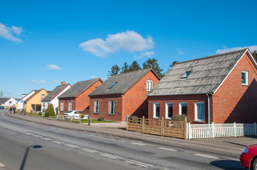 Fototapeta na wymiar houses near the road in town of Hoeng in Denmark