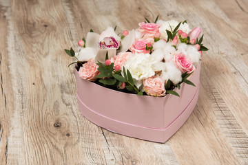 Close-up of box with white and pink flowers - Powered by Adobe