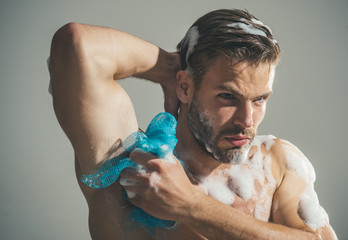 Spa and beauty, relax and hygiene, healthcare - handsome man washing with sponge in shower....