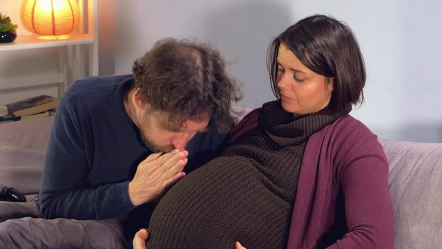 Pregnant couple making piece after fight in love