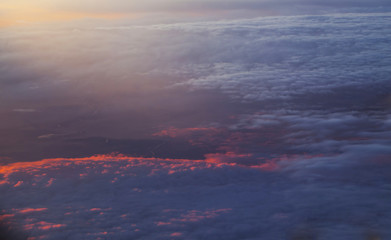 Fototapeta na wymiar Sunrise over clouds