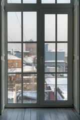 Fototapeta na wymiar large French window overlooking the winter city