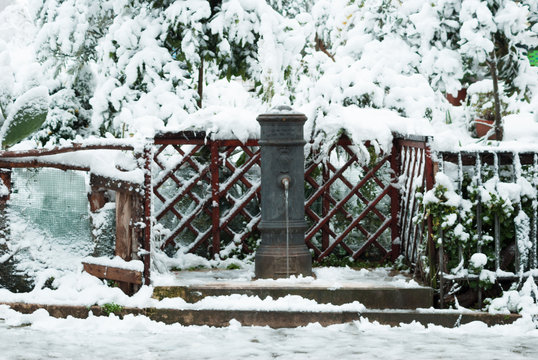Roman fountain in the Centocelle district surrounded by snow