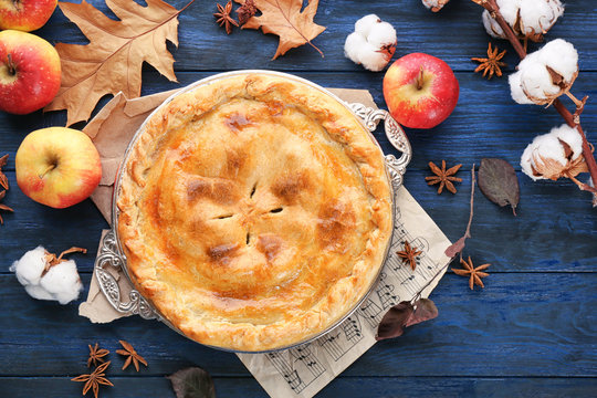 Freshly baked apple pie on table, top view