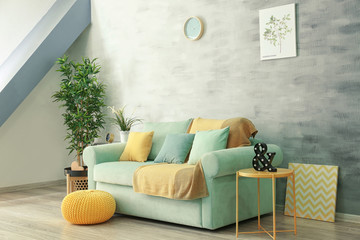 Living room interior with comfortable mint couch