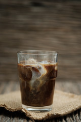 Classic still life a glass of coffee with copy space, vertical vintage picture.