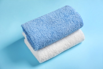 Clean towels on color background
