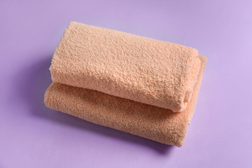 Fototapeta na wymiar Clean towels on color background