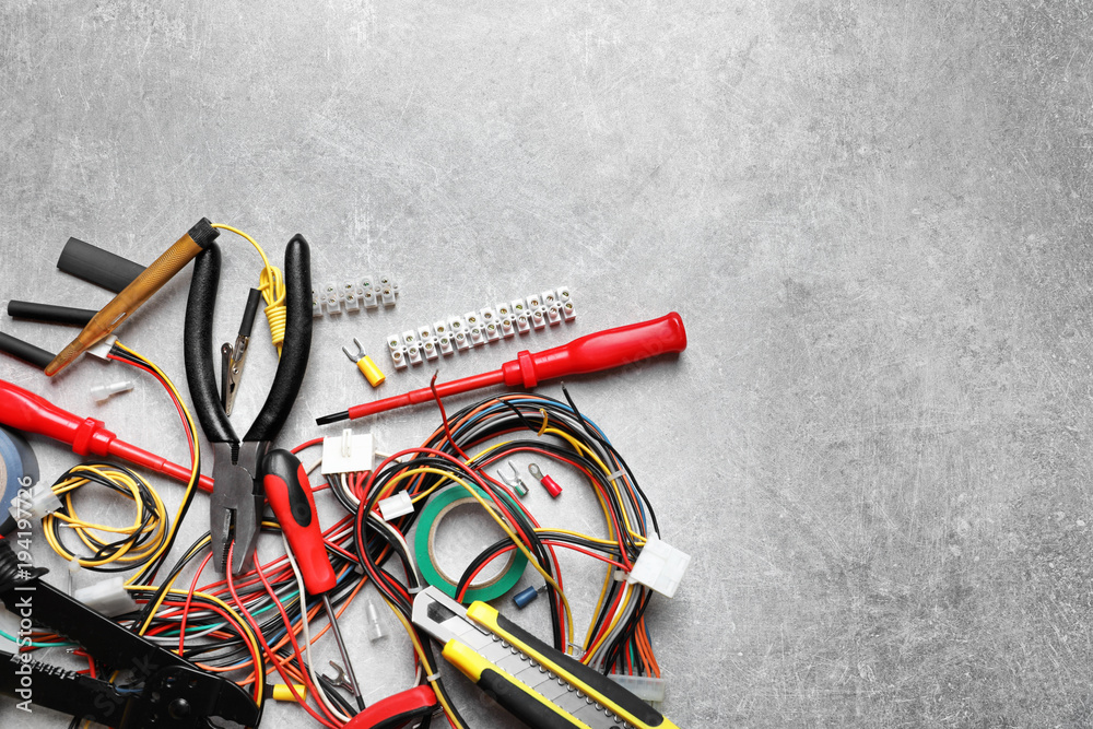 Wall mural different electrical tools on grey background