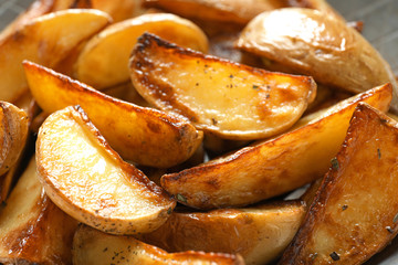 Tasty potato wedges, closeup