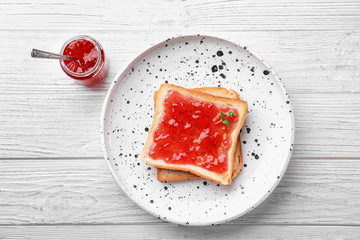 Delicious toast with sweet jam on plate