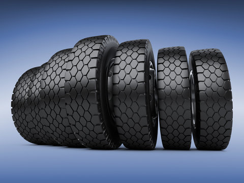 Row of big vehicle truck tires. New car wheels.