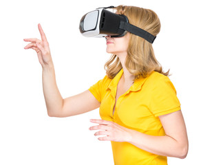 Happy woman wearing virtual reality goggles watching movies or playing video games, isolated on white background. Smiling female looking in VR glasses and gesturing with hands.