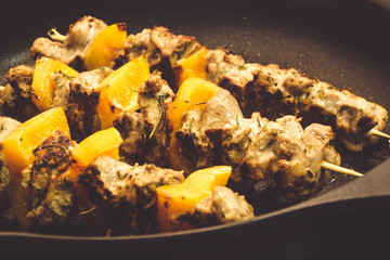Pork skewer kebab on stove top grill