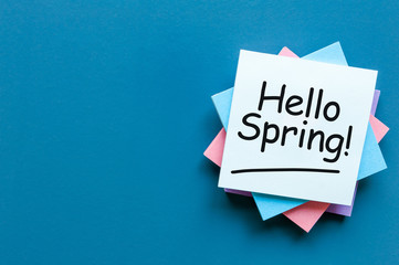 Hello Spring - note at work place with empty space for text, mockup or template. spring time beginning