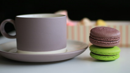 Chocolate macron and a cup of drink.