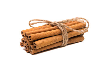 Cinnamon sticks tied with a rope, isolated on white background.