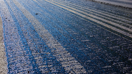 Obraz premium Traces of bitumen on the pavement