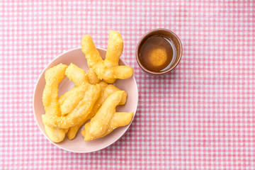 Youtiao deep fried dough stick a kind of Chinese flour sweet meal Chinese breakfast and Thailand called Pa Tong Ko eat with hot tea, coffee or soy milk delicious Thai food dessert