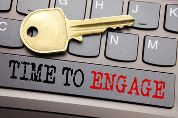 Hand writing text caption inspiration showing Time To Engage. Business concept for Engagement Involvement written on keyboard key on the with key next to the text.