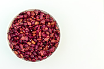 kidney bean in white tableware on a white background