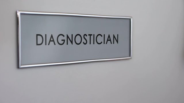 Diagnostician office door hospital, hand knocking closeup, doctor consultation