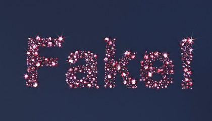 Set of precious stones scattered on the surface in the form of the word 