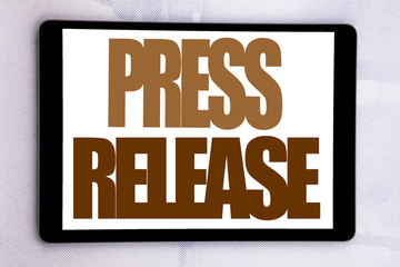 Fototapeta premium Hand writing text caption inspiration showing Press Release. Business concept for Statement Announcement Message written on tablet screen on the white background.