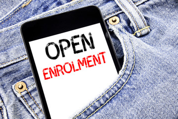 Handwriting Announcement text showing Open Enrolment. Business concept for Medicine Doctor Enroll Written phone mobile phone, cellphone placed in the man front jeans pocket.