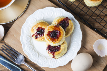 English scones with cream and strawberry jam