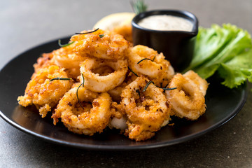 fried squids or octopus (calamari) with sauce