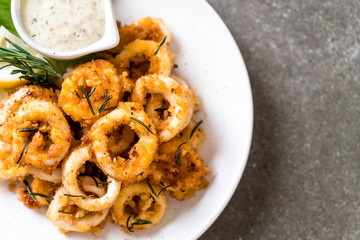 fried squids or octopus (calamari) with sauce