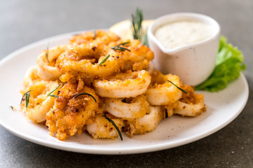 fried squids or octopus (calamari) with sauce