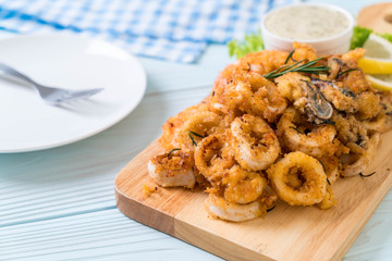 fried seafood (squids, shrimps, mussels) with sauce