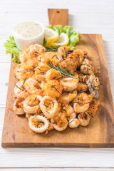 fried seafood (squids, shrimps, mussels) with sauce