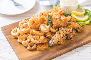 fried seafood (squids, shrimps, mussels) with sauce