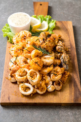 fried seafood (squids, shrimps, mussels) with sauce