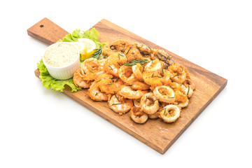 fried seafood (squids, shrimps, mussels) with sauce