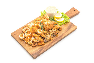 fried seafood (squids, shrimps, mussels) with sauce