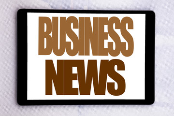 Hand writing text caption inspiration showing Business News. Business concept for Modern Online News written on tablet screen on the white background.