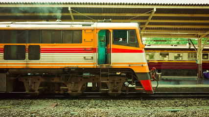 Old diesel train running for reconnect at a platform of railway station Hua Lamphong in Bangkok
