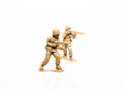 Two plastic tan soldiers