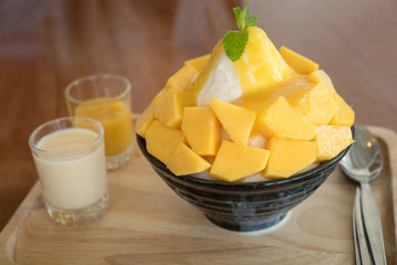 Bingsu ( Korea food) mango served with sweetened condensed milk