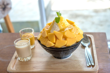 Bingsu ( Korea food) mango served with sweetened condensed milk