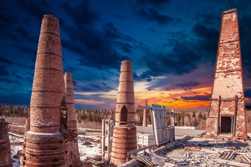 Ancient pipes made of bricks. Abandoned factory. Chimney pipes. Abandoned territory of the...