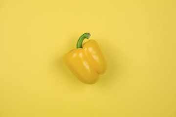 Yellow pepper on yellow background