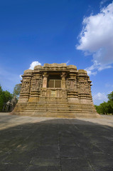 Fototapeta na wymiar Outer view of the Sun Temple on the bank of the river Pushpavati. Built in 1026 - 27 AD, Modhera village of Mehsana district, Gujarat, India