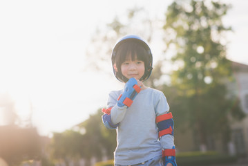 Close up of Cute Asian boy in blue helmet